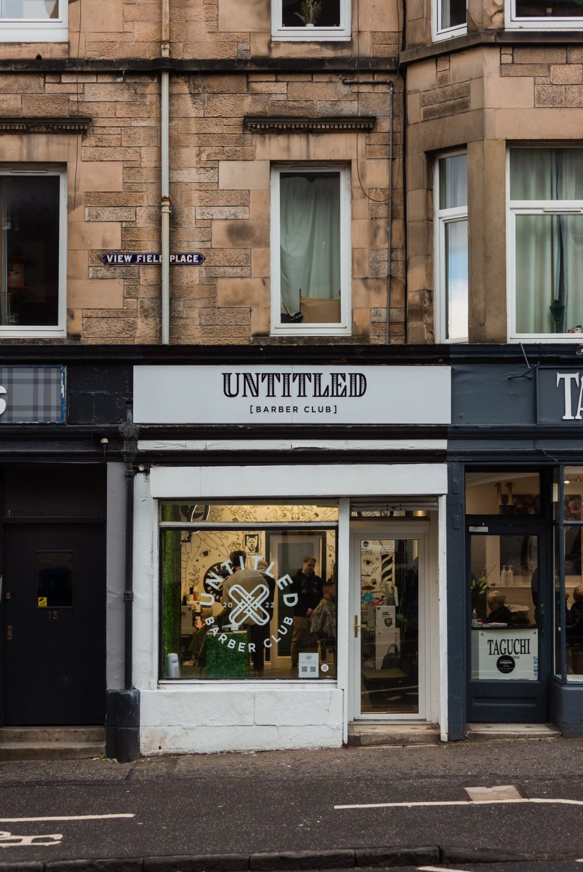 The white Untitled Barber Club shopfront on Viewfield Place